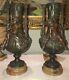 MOREAU L&F. Paire de grands vases en régule, décor en ronde-bosse de chérubins