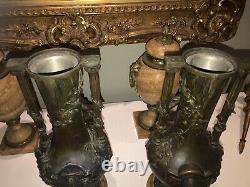 MOREAU L&F. Paire de grands vases en régule, décor en ronde-bosse de chérubins